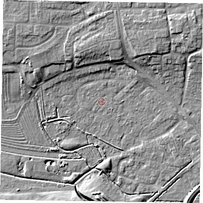 Shaded relief map of the ground around NG243HS, computed from Environment Agency LiDAR. The ground here sits at about 13 m above sea level and falls 10 m across the surrounding 800 m. Surface water reaching this point runs off ground lying to the north, 6.1 m higher.