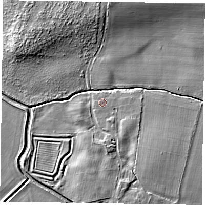 Shaded relief map of the ground around NG243RR, computed from Environment Agency LiDAR. The ground here sits at about 13 m above sea level and falls 9 m across the surrounding 800 m. Surface water reaching this point runs off ground lying to the south-east, 2.1 m higher.