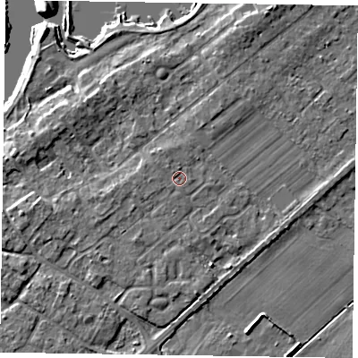 Shaded relief map of the ground around NG243TD, computed from Environment Agency LiDAR. The ground here sits at about 13 m above sea level and falls 6 m across the surrounding 800 m. Surface water reaching this point runs off ground lying to the north-north-west, 0.9 m higher.