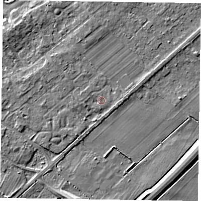 Shaded relief map of the ground around NG243TR, computed from Environment Agency LiDAR. The ground here sits at about 13 m above sea level and falls 6 m across the surrounding 800 m. Surface water reaching this point runs off ground lying to the south-west, 1.7 m higher.