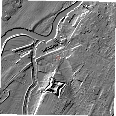 Shaded relief map of the ground around NG244SG, computed from Environment Agency LiDAR. The ground here sits at about 12 m above sea level and falls 11 m across the surrounding 800 m. Surface water reaching this point runs off ground lying to the south, 6.2 m higher.
