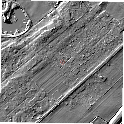 Shaded relief map of the ground around NG244SX, computed from Environment Agency LiDAR. The ground here sits at about 13 m above sea level and falls 6 m across the surrounding 800 m. Surface water reaching this point runs off ground lying to the north-north-west, 2.7 m higher.