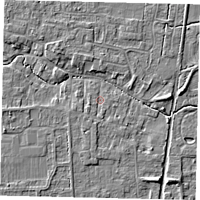 Shaded relief map of the ground around NG349DR, computed from Environment Agency LiDAR. The ground here sits at about 11 m above sea level and falls 7 m across the surrounding 800 m. Surface water reaching this point runs off ground lying to the south-west, 1.6 m higher.