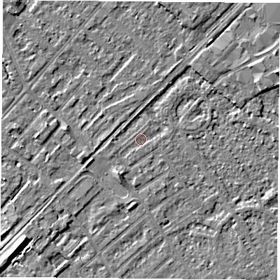 Shaded relief map of the ground around NG91QP, computed from Environment Agency LiDAR. The ground here sits at about 26 m above sea level and falls 9 m across the surrounding 800 m. Surface water reaching this point runs off ground lying to the south-south-west, 2.6 m higher.