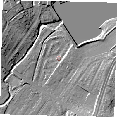 Shaded relief map of the ground around NW100DS, computed from Environment Agency LiDAR. The ground here sits at about 33 m above sea level and falls 17 m across the surrounding 800 m. Surface water reaching this point runs off ground lying to the east-north-east, 4.8 m higher.