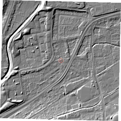Shaded relief map of the ground around NW100PU, computed from Environment Agency LiDAR. The ground here sits at about 29 m above sea level and falls 11 m across the surrounding 800 m. Surface water reaching this point runs off ground lying to the north-east, 1.8 m higher.