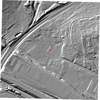 Shaded relief map of the ground around NW100RE, computed from Environment Agency LiDAR. The ground here sits at about 25 m above sea level and falls 18 m across the surrounding 800 m. Surface water reaching this point runs off ground lying to the east-north-east, 12.1 m higher.