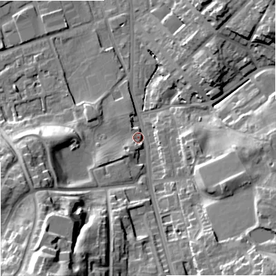 Shaded relief map of the ground around OL112AL, computed from Environment Agency LiDAR. The ground here sits at about 142 m above sea level and falls 38 m across the surrounding 800 m. Surface water reaching this point runs off ground lying to the south-south-west, 33.0 m higher.
