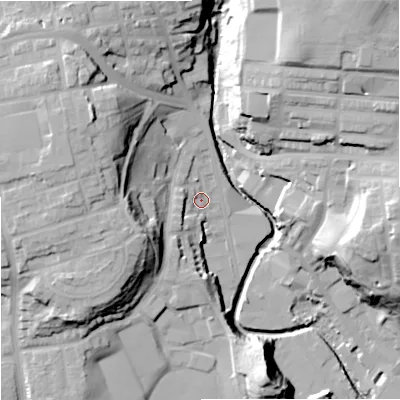 Shaded relief map of the ground around OL115BL, computed from Environment Agency LiDAR. The ground here sits at about 125 m above sea level and falls 40 m across the surrounding 800 m. Surface water reaching this point runs off ground lying to the north-west, 26.4 m higher.