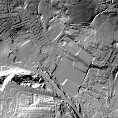 Shaded relief map of the ground around OL127SY, computed from Environment Agency LiDAR. The ground here sits at about 161 m above sea level and falls 54 m across the surrounding 800 m. Surface water reaching this point runs off ground lying to the west-south-west, 6.9 m higher.