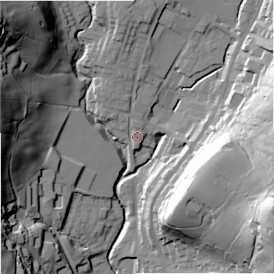 Shaded relief map of the ground around OL128AE, computed from Environment Agency LiDAR. The ground here sits at about 221 m above sea level and falls 66 m across the surrounding 800 m. Surface water reaching this point runs off ground lying to the north-north-west, 2.6 m higher.