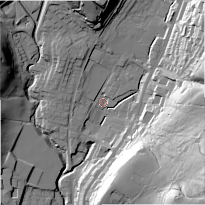 Shaded relief map of the ground around OL128AZ, computed from Environment Agency LiDAR. The ground here sits at about 220 m above sea level and falls 69 m across the surrounding 800 m. Surface water reaching this point runs off ground lying to the north, 34.6 m higher.