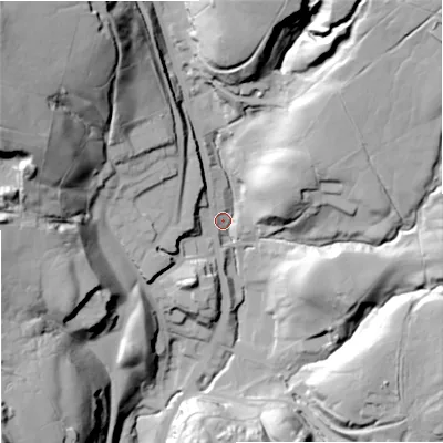 Shaded relief map of the ground around OL128HG, computed from Environment Agency LiDAR. The ground here sits at about 263 m above sea level and falls 74 m across the surrounding 800 m. Surface water reaching this point runs off ground lying to the north-west, 65.2 m higher.