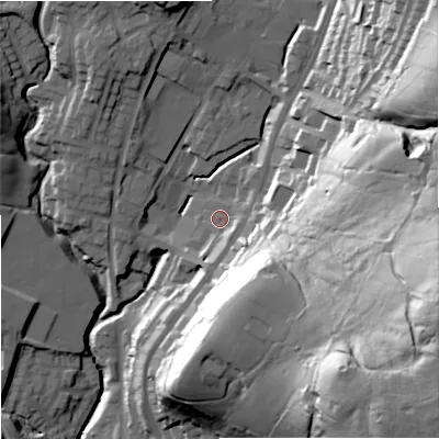 Shaded relief map of the ground around OL128RG, computed from Environment Agency LiDAR. The ground here sits at about 221 m above sea level and falls 76 m across the surrounding 800 m. Surface water reaching this point runs off ground lying to the east-south-east, 65.0 m higher.