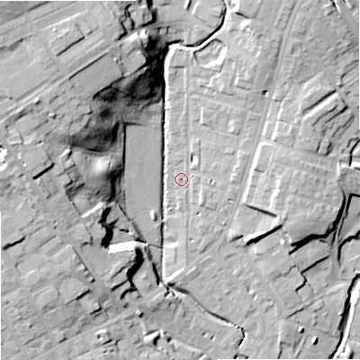 Shaded relief map of the ground around OL129BJ, computed from Environment Agency LiDAR. The ground here sits at about 128 m above sea level and falls 33 m across the surrounding 800 m. Surface water reaching this point runs off ground lying to the north-north-east, 12.4 m higher.