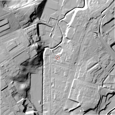 Shaded relief map of the ground around OL129BX, computed from Environment Agency LiDAR. The ground here sits at about 133 m above sea level and falls 38 m across the surrounding 800 m. Surface water reaching this point runs off ground lying to the east-north-east, 4.6 m higher.