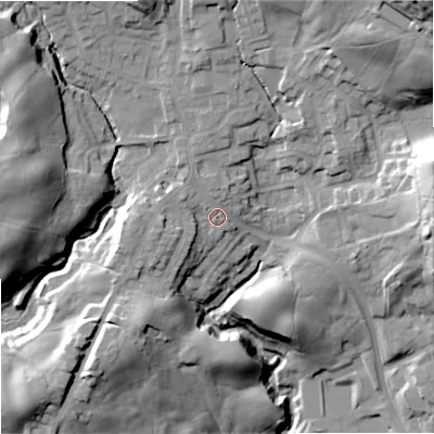 Shaded relief map of the ground around OL129LH, computed from Environment Agency LiDAR. The ground here sits at about 186 m above sea level and falls 57 m across the surrounding 800 m. Surface water reaching this point runs off ground lying to the west-south-west, 4.9 m higher.