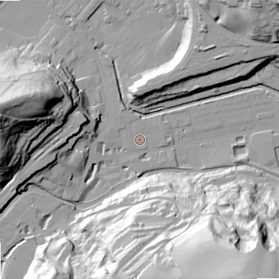 Shaded relief map of the ground around OL145AW, computed from Environment Agency LiDAR. The ground here sits at about 125 m above sea level and falls 91 m across the surrounding 800 m. Surface water reaching this point runs off ground lying to the west-north-west, 1.9 m higher.