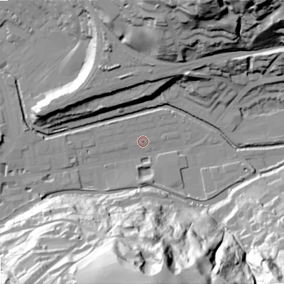 Shaded relief map of the ground around OL145BJ, computed from Environment Agency LiDAR. The ground here sits at about 123 m above sea level and falls 87 m across the surrounding 800 m. Surface water reaching this point runs off ground lying to the south-east, 86.7 m higher.
