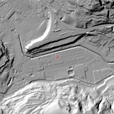 Shaded relief map of the ground around OL145BP, computed from Environment Agency LiDAR. The ground here sits at about 124 m above sea level and falls 83 m across the surrounding 800 m. Surface water reaching this point runs off ground lying to the south, 72.3 m higher.