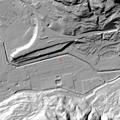 Shaded relief map of the ground around OL145BT, computed from Environment Agency LiDAR. The ground here sits at about 124 m above sea level and falls 80 m across the surrounding 800 m. Surface water reaching this point runs off ground lying to the south, 75.7 m higher.