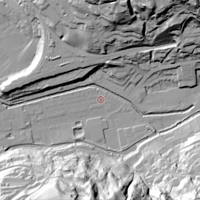 Shaded relief map of the ground around OL145BX, computed from Environment Agency LiDAR. The ground here sits at about 123 m above sea level and falls 80 m across the surrounding 800 m. Surface water reaching this point runs off ground lying to the south, 79.0 m higher.