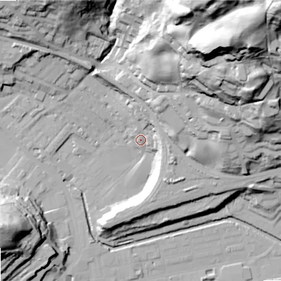 Shaded relief map of the ground around OL145DR, computed from Environment Agency LiDAR. The ground here sits at about 131 m above sea level and falls 116 m across the surrounding 800 m. Surface water reaching this point runs off ground lying to the north-east, 82.3 m higher.