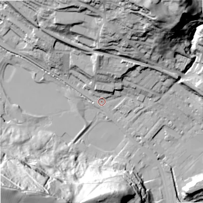 Shaded relief map of the ground around OL145HX, computed from Environment Agency LiDAR. The ground here sits at about 127 m above sea level and falls 114 m across the surrounding 800 m. Surface water reaching this point runs off ground lying to the north, 20.9 m higher.