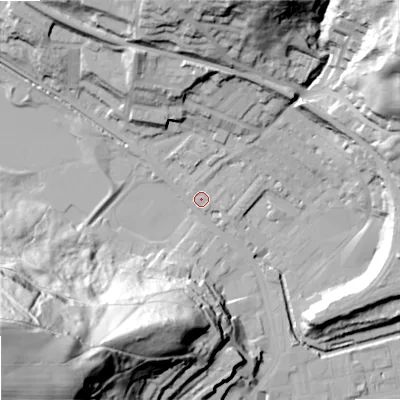 Shaded relief map of the ground around OL145LH, computed from Environment Agency LiDAR. The ground here sits at about 127 m above sea level and falls 99 m across the surrounding 800 m. Surface water reaching this point runs off ground lying to the north, 34.6 m higher.
