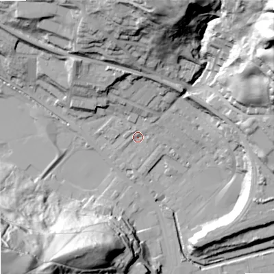 Shaded relief map of the ground around OL145LP, computed from Environment Agency LiDAR. The ground here sits at about 127 m above sea level and falls 92 m across the surrounding 800 m. Surface water reaching this point runs off ground lying to the north-east, 3.1 m higher.
