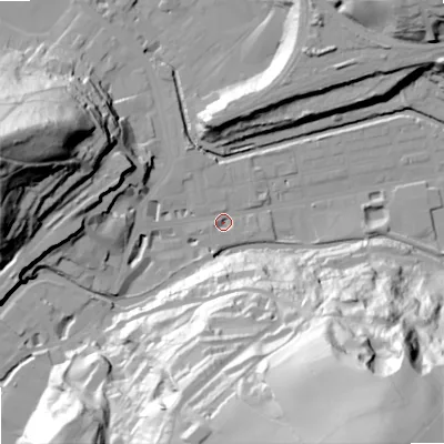 Shaded relief map of the ground around OL145QG, computed from Environment Agency LiDAR. The ground here sits at about 124 m above sea level and falls 96 m across the surrounding 800 m. Surface water reaching this point runs off ground lying to the south-south-east, 91.9 m higher.