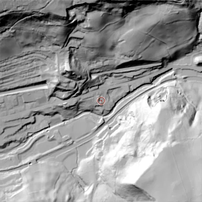 Shaded relief map of the ground around OL145RJ, computed from Environment Agency LiDAR. The ground here sits at about 127 m above sea level and falls 120 m across the surrounding 800 m. Surface water reaching this point runs off ground lying to the north-west, 49.8 m higher.