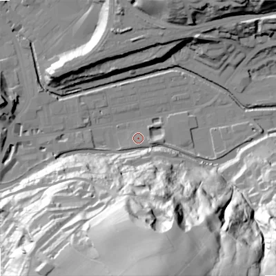 Shaded relief map of the ground around OL145RN, computed from Environment Agency LiDAR. The ground here sits at about 124 m above sea level and falls 97 m across the surrounding 800 m. Surface water reaching this point runs off ground lying to the south, 96.3 m higher.