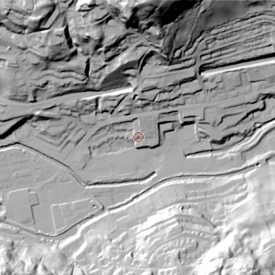 Shaded relief map of the ground around OL145RZ, computed from Environment Agency LiDAR. The ground here sits at about 129 m above sea level and falls 104 m across the surrounding 800 m. Surface water reaching this point runs off ground lying to the north-north-east, 10.4 m higher.