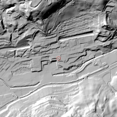 Shaded relief map of the ground around OL145SF, computed from Environment Agency LiDAR. The ground here sits at about 135 m above sea level and falls 110 m across the surrounding 800 m. Surface water reaching this point runs off ground lying to the north-west, 8.8 m higher.