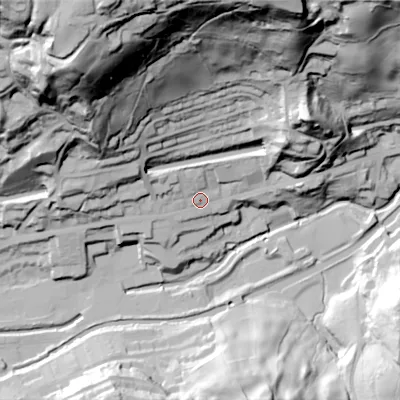 Shaded relief map of the ground around OL145SQ, computed from Environment Agency LiDAR. The ground here sits at about 133 m above sea level and falls 120 m across the surrounding 800 m. Surface water reaching this point runs off ground lying to the north-north-west, 106.0 m higher.