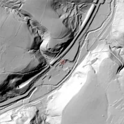 Shaded relief map of the ground around OL146DG, computed from Environment Agency LiDAR. The ground here sits at about 120 m above sea level and falls 84 m across the surrounding 800 m. Surface water reaching this point runs off ground lying to the south-east, 82.4 m higher.