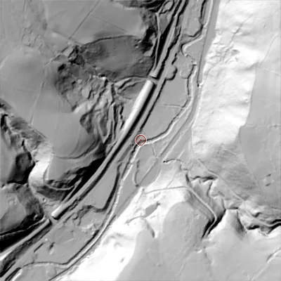 Shaded relief map of the ground around OL146DH, computed from Environment Agency LiDAR. The ground here sits at about 115 m above sea level and falls 102 m across the surrounding 800 m. Surface water reaching this point runs off ground lying to the east-north-east, 101.1 m higher.