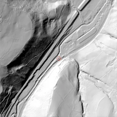 Shaded relief map of the ground around OL146EH, computed from Environment Agency LiDAR. The ground here sits at about 113 m above sea level and falls 144 m across the surrounding 800 m. Surface water reaching this point runs off ground lying to the west-north-west, 134.0 m higher.