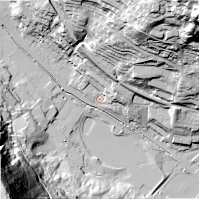 Shaded relief map of the ground around OL147DE, computed from Environment Agency LiDAR. The ground here sits at about 132 m above sea level and falls 144 m across the surrounding 800 m. Surface water reaching this point runs off ground lying to the east-north-east, 11.2 m higher.