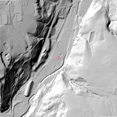 Shaded relief map of the ground around OL147NG, computed from Environment Agency LiDAR. The ground here sits at about 134 m above sea level and falls 119 m across the surrounding 800 m. Surface water reaching this point runs off ground lying to the south-south-west, 2.2 m higher.