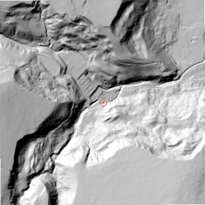 Shaded relief map of the ground around OL147UN, computed from Environment Agency LiDAR. The ground here sits at about 184 m above sea level and falls 127 m across the surrounding 800 m. Surface water reaching this point runs off ground lying to the south-east, 107.1 m higher.