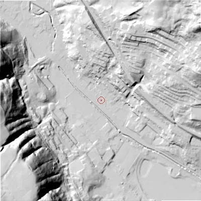 Shaded relief map of the ground around OL148EA, computed from Environment Agency LiDAR. The ground here sits at about 132 m above sea level and falls 138 m across the surrounding 800 m. Surface water reaching this point runs off ground lying to the west-north-west, 70.9 m higher.