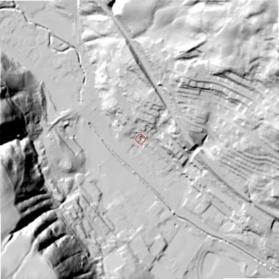 Shaded relief map of the ground around OL148EQ, computed from Environment Agency LiDAR. The ground here sits at about 136 m above sea level and falls 131 m across the surrounding 800 m. Surface water reaching this point runs off ground lying to the north-north-east, 26.8 m higher.