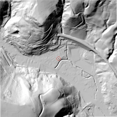 Shaded relief map of the ground around OL148HT, computed from Environment Agency LiDAR. The ground here sits at about 143 m above sea level and falls 163 m across the surrounding 800 m. Surface water reaching this point runs off ground lying to the north-north-west, 108.4 m higher.
