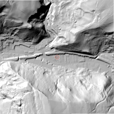 Shaded relief map of the ground around OL148NF, computed from Environment Agency LiDAR. The ground here sits at about 186 m above sea level and falls 143 m across the surrounding 800 m. Surface water reaching this point runs off ground lying to the north-west, 7.4 m higher.