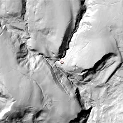 Shaded relief map of the ground around OL148NU, computed from Environment Agency LiDAR. The ground here sits at about 245 m above sea level and falls 135 m across the surrounding 800 m. Surface water reaching this point runs off ground lying to the north-east, 86.2 m higher.