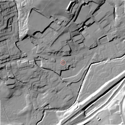 Shaded relief map of the ground around OL158JP, computed from Environment Agency LiDAR. The ground here sits at about 144 m above sea level and falls 33 m across the surrounding 800 m. Surface water reaching this point runs off ground lying to the west, 2.7 m higher.