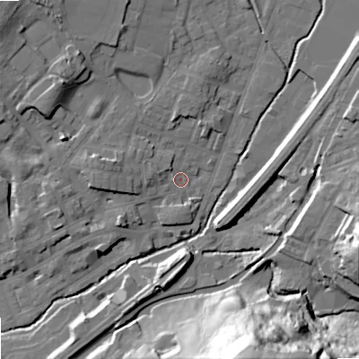 Shaded relief map of the ground around OL159DE, computed from Environment Agency LiDAR. The ground here sits at about 144 m above sea level and falls 57 m across the surrounding 800 m. Surface water reaching this point runs off ground lying to the west-north-west, 6.2 m higher.