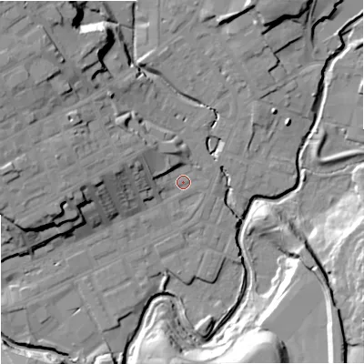 Shaded relief map of the ground around OL162EX, computed from Environment Agency LiDAR. The ground here sits at about 125 m above sea level and falls 25 m across the surrounding 800 m. Surface water reaching this point runs off ground lying to the west-north-west, 8.7 m higher.